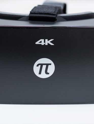 Pimax 4K VR headset, front view with retail box in background.