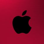 Apple AR VR Headset - Apple logo on a red, brushed metal background.